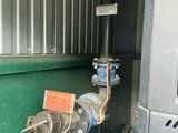 a pipe that is connected to the side of a building