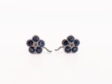 a pair of sapphire and diamond flower earrings