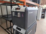a machine that is sitting on a shelf in a warehouse