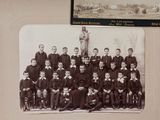 an old photo of a group of men posing for a picture