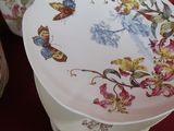 three plates and a bowl sitting on a red table