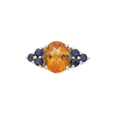 une bague ovale sertie d'une citrine et d'un saphir
