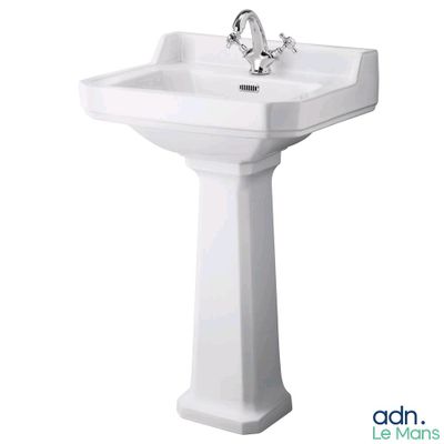 an image of a white pedestal sink with a chrome faucet