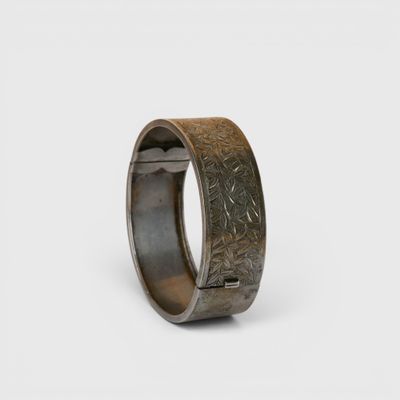 a close up of a ring on a white surface