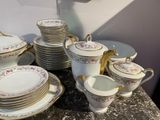 a lot of plates and cups on the table