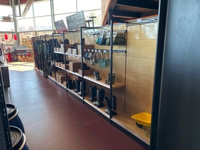 a room with a lot of shoes on the shelves
