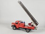 a red fire truck with a ladder on the back of it