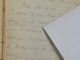 a piece of paper with writing on it next to a piece of paper with writing on it