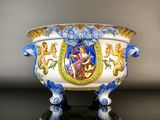 a white bowl with a blue and yellow design on it