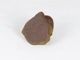 a piece of chocolate sitting on top of a white surface