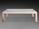 the table is made of wood and has a glass top