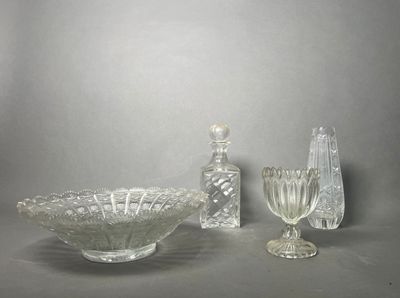 a glass bowl and a glass vase on a table