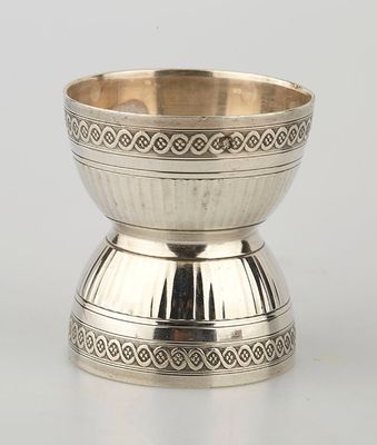 a silver bowl with a decorative design on the rim