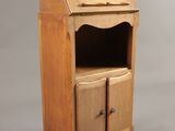 une image représentant une petite armoire en bois avec un tiroir