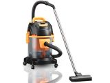 a black and orange vacuum cleaner is sitting on a white surface