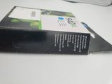 a box of ink sitting on a desk next to a keyboard
