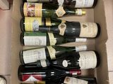 many bottles of wine in a box on the floor