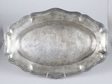 an antique silver tray with a handle and a handle