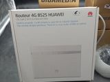 a white box with a picture on it next to a computer mouse