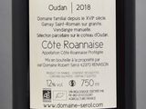 a label on a bottle of wine on a table