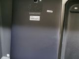 two samsung phones sitting next to each other on a table