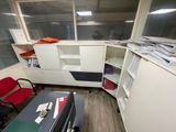 a room with a desk and a chair in it