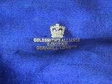 the logo on the blue shirt is gold and has a crown on it