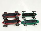 three skateboards that are sitting next to each other on a table