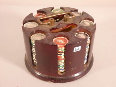 a small wooden box with buttons on it on a table