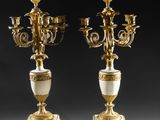 a pair of antique brass and marble candelabs
