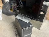 a computer sitting on top of a desk with a monitor on it