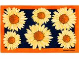 un tapis orange et bleu orné de tournesols