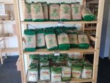 many bags of food on the shelves in the store