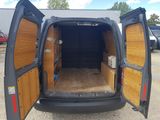 the back of a van with its doors open in a parking lot