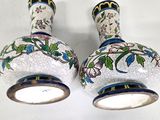 two vases that have been decorated with flowers on them