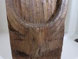 a large piece of wood with a ring on it