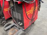 a machine that is sitting on the ground in the garage