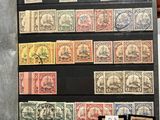 an open book with a bunch of different stamps on it