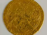 an image of a gold coin on a white surface