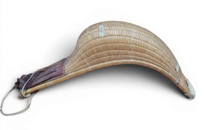 a wicker hat with an umbrella attached to it