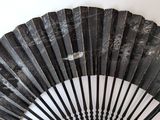 a black fan that is sitting on a white table