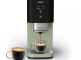 an image of a coffee machine with a cup of coffee