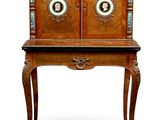 an old wooden cabinet with two doors and a drawer on top of it