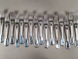 a lot of forks and spoons that are on a table
