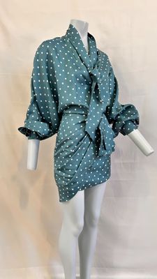 an image of a mannequin dressed in a polka dot print dress