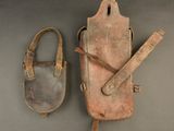 two pieces of old leather are sitting next to each other