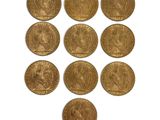 a group of six gold sovereigns of various sizes and shapes