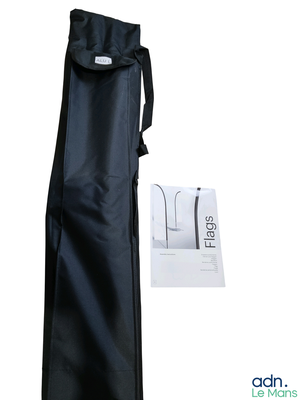 a black bag with a black handle next to it