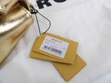 a gold purse with a price tag on top of it