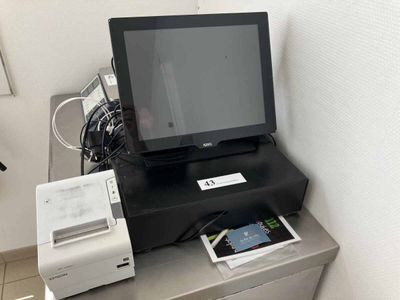 a small tv and printer on a desk in a room